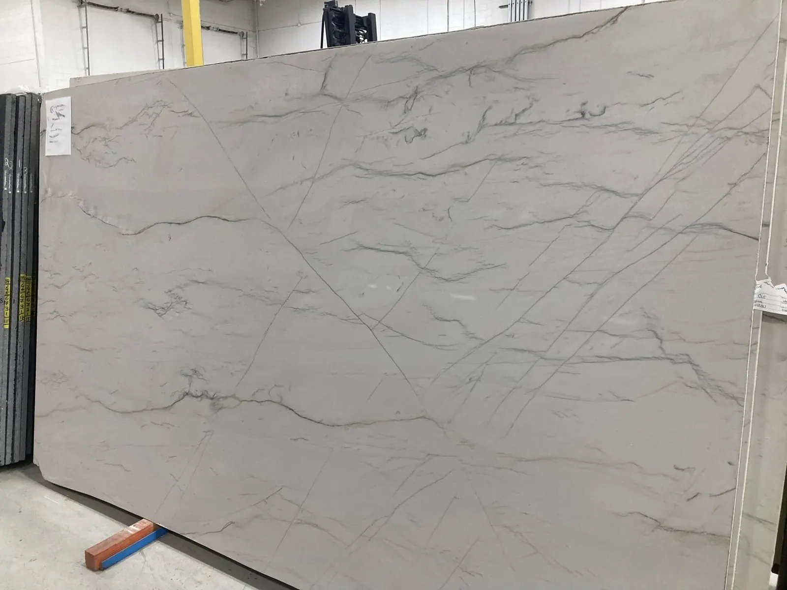 White natural stone slab with soft gray veining